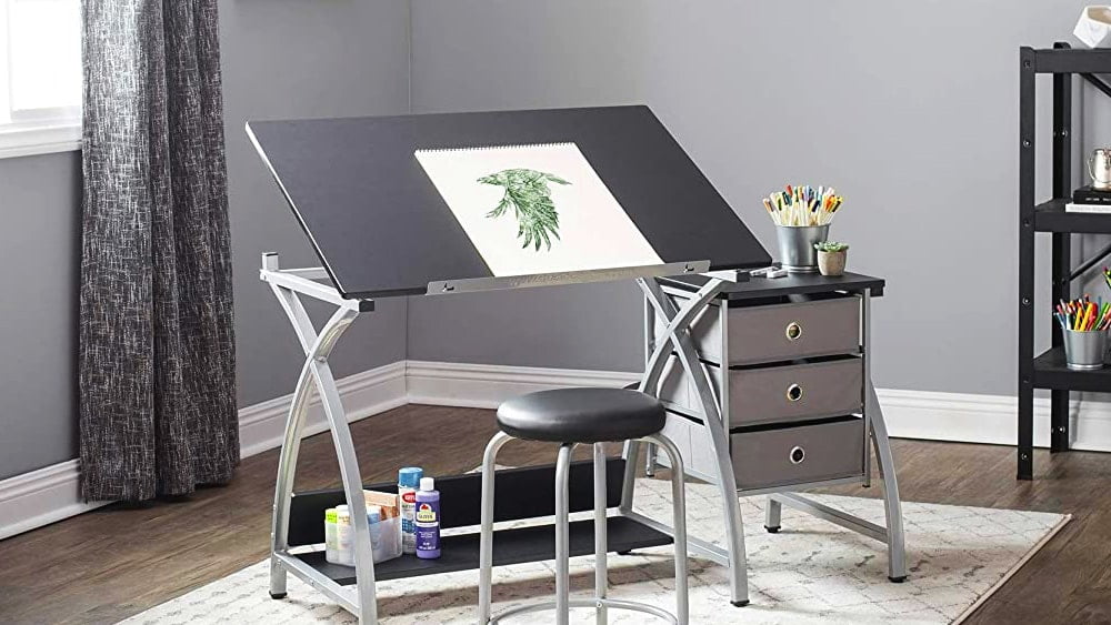 Drawing table with drawers and a stool, located in a room of a house.