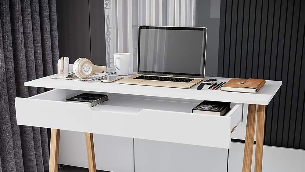 Melamine desk with a laptop computer and various accessories on the table top