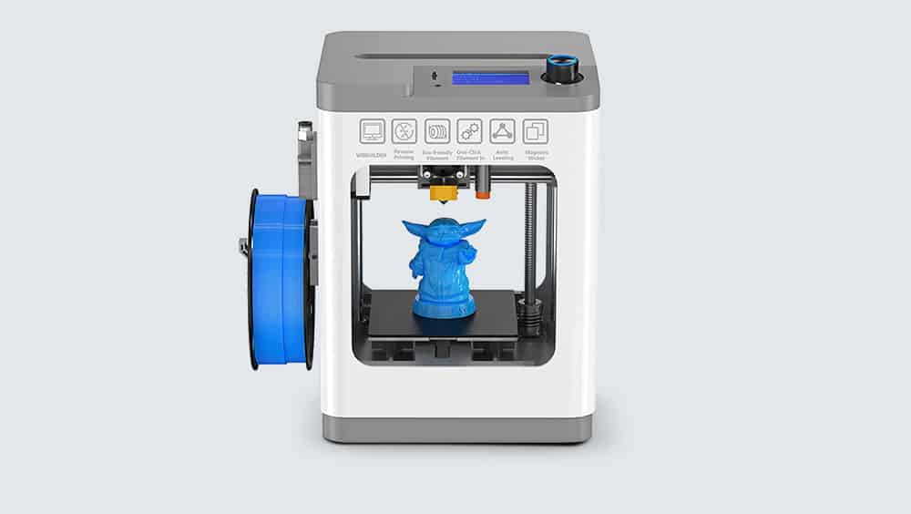 Tina 2 printer after printing a blue figure of Baby Yoda